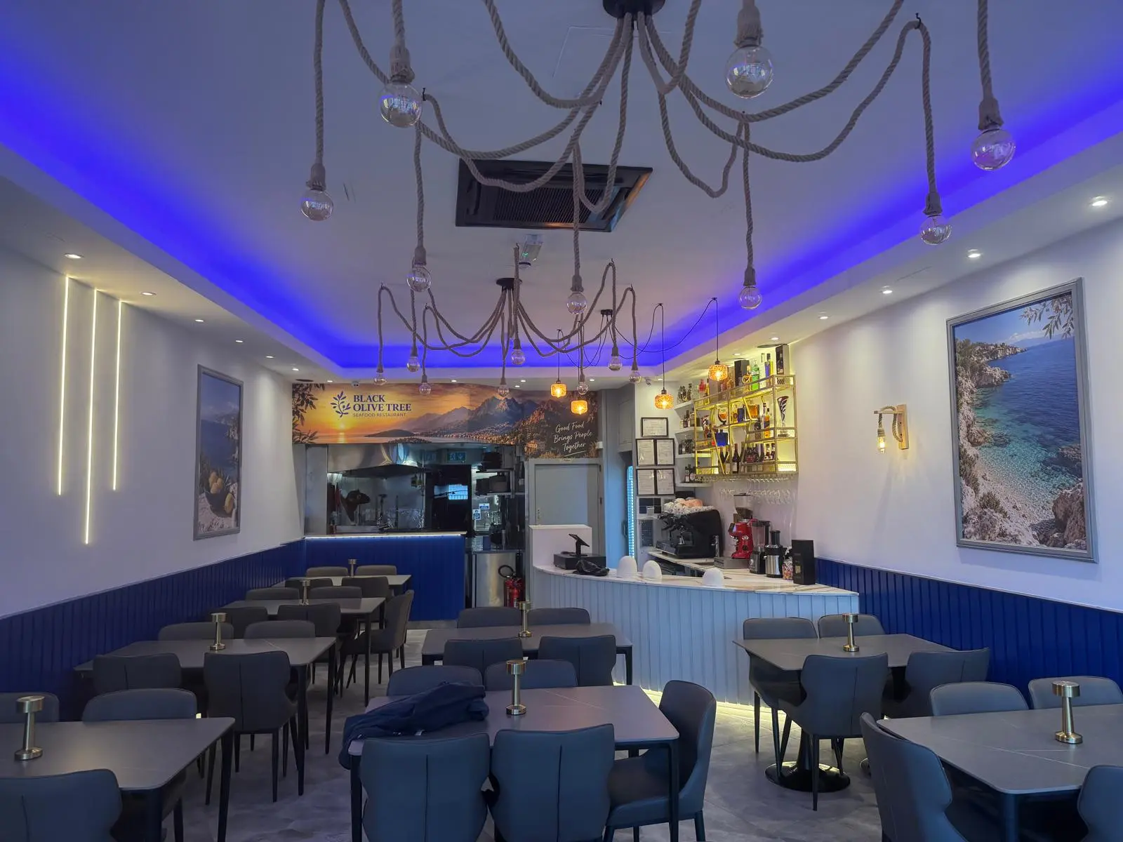 Tables set for an evening event at Black Olive Tree